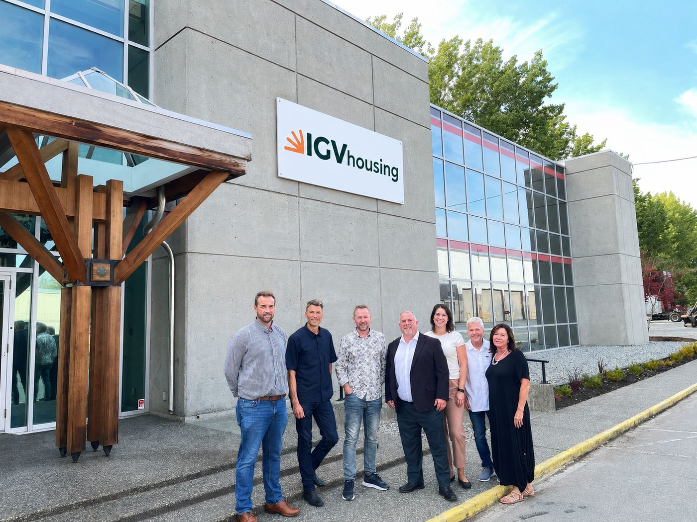The IGV team standing together outside in matching orange t-shirts